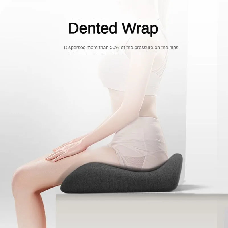 Person sitting on a gray dented wrap cushion with text on a white background