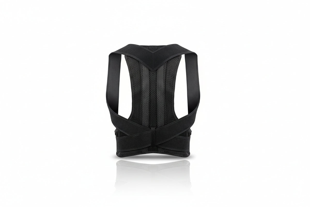 A black posture corrector back brace with breathable mesh panels and adjustable straps, shown from the back on a white background with a soft reflection.